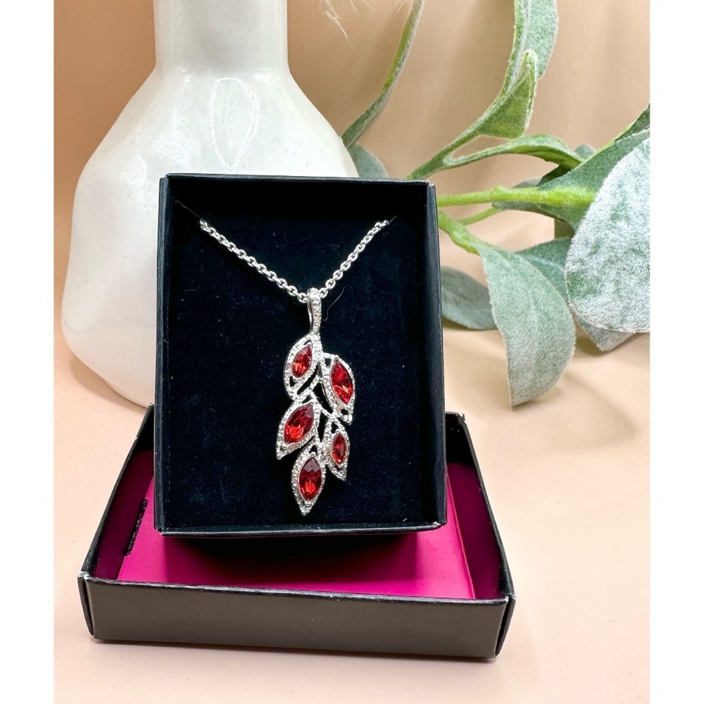 New in box Avon Vintage SAQ Silver Tone and Faux Ruby Rhinestone Leaf Necklace